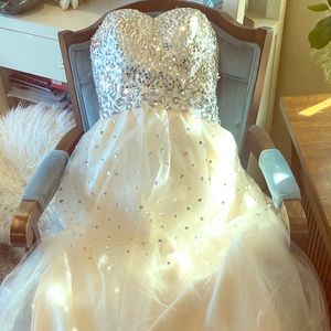 Formal beaded gown. Never been worn. No tags.